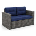 Gartensofa 2-Sitzer aus Rattan mit blauen Kissen